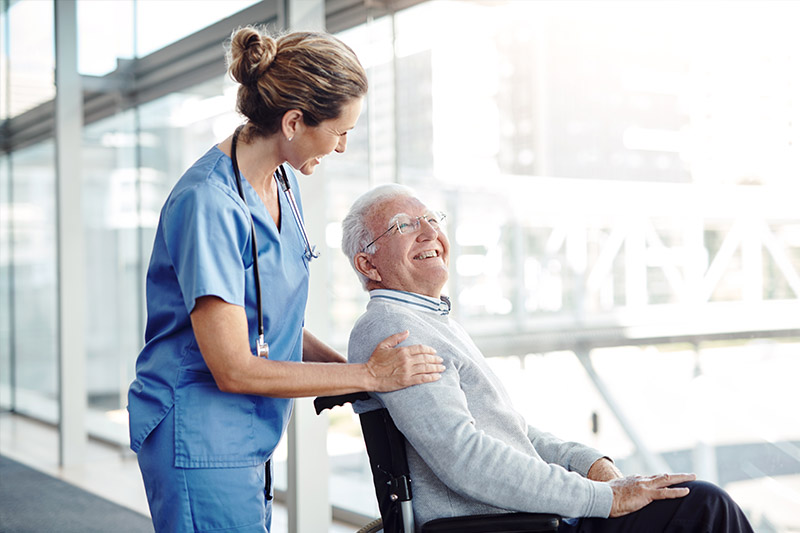 Doctor with patient in wheelchair