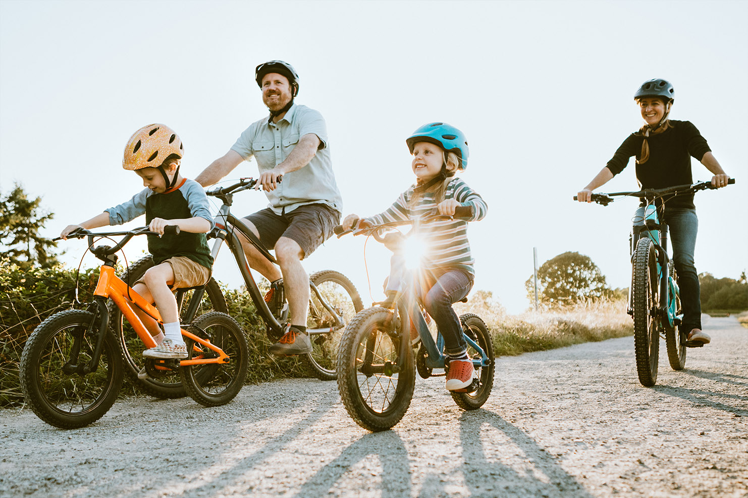 Dad and mom with kids on bikes