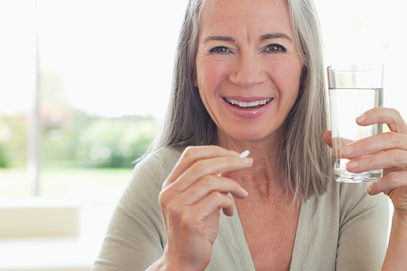 Woman taking medication