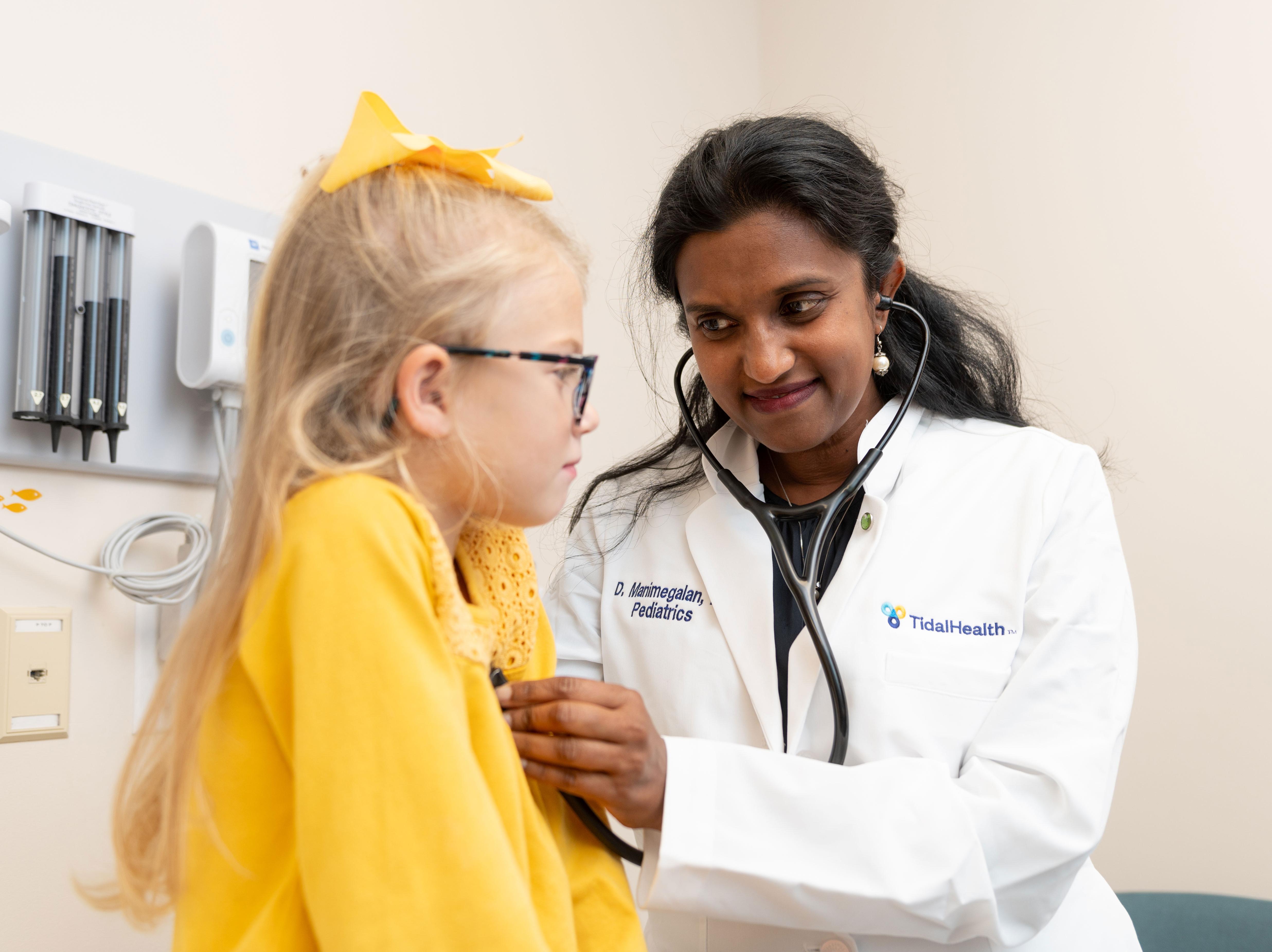 Experienced pediatrician conducting a thorough examination on a young patient with care and compassion.