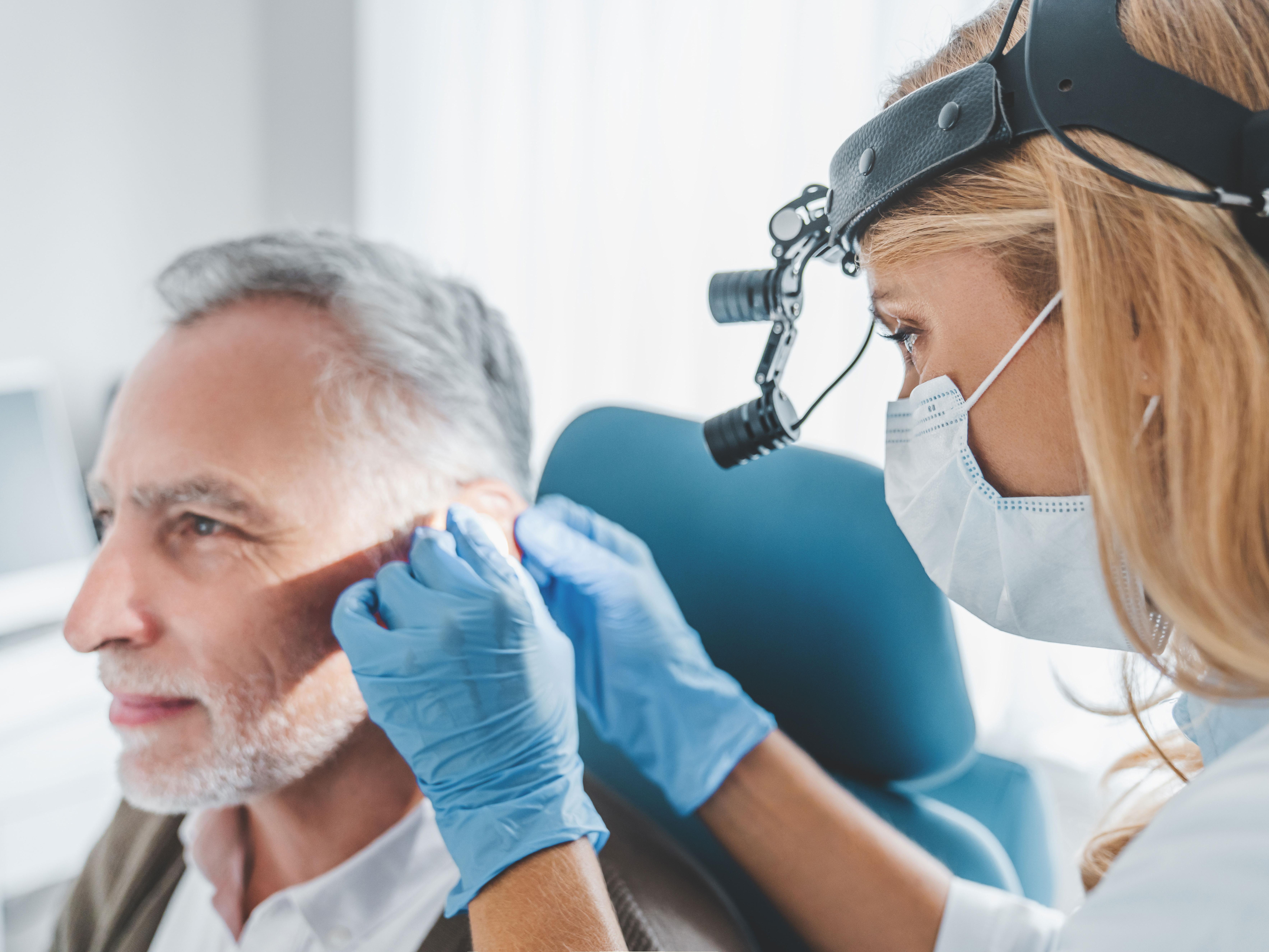 An ENT doctor examining a patient