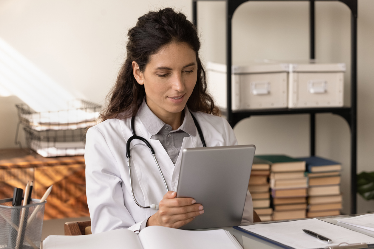 Practitioner looking at tablet