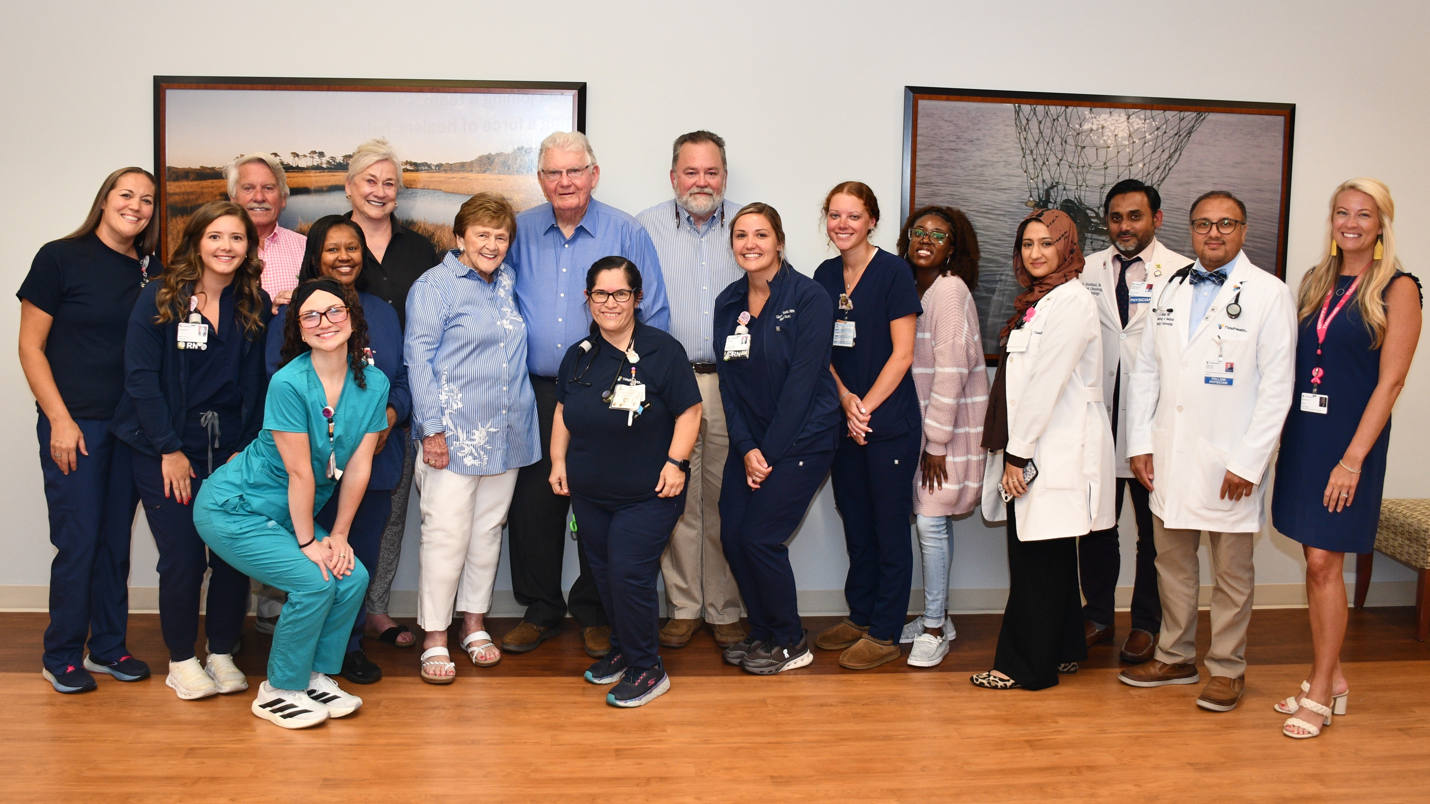 Group photo of caregivers and grateful family