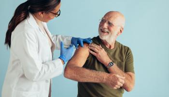 Senior man receiving immunization