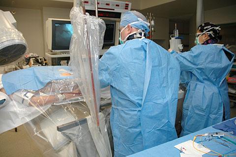 Surgeon and clinical staff operate on a patient in the TidalHealth Cardiac Interventional Center.
