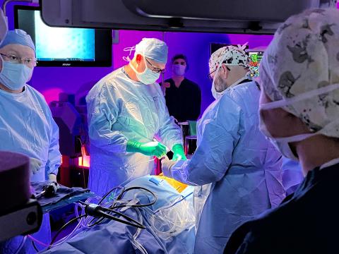 Robotic surgical team performing surgery