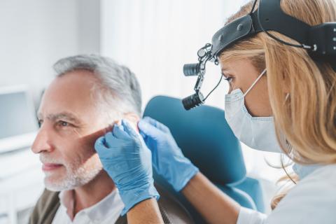 An ENT doctor examining a patient