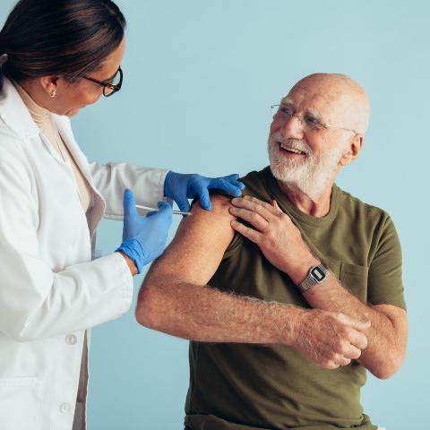Senior man receiving immunization