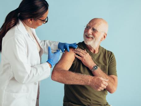 Senior man receiving immunization