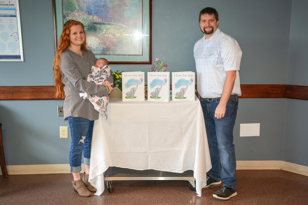 Allyssa Briggs and Ryan Conkle with their newborn daughter