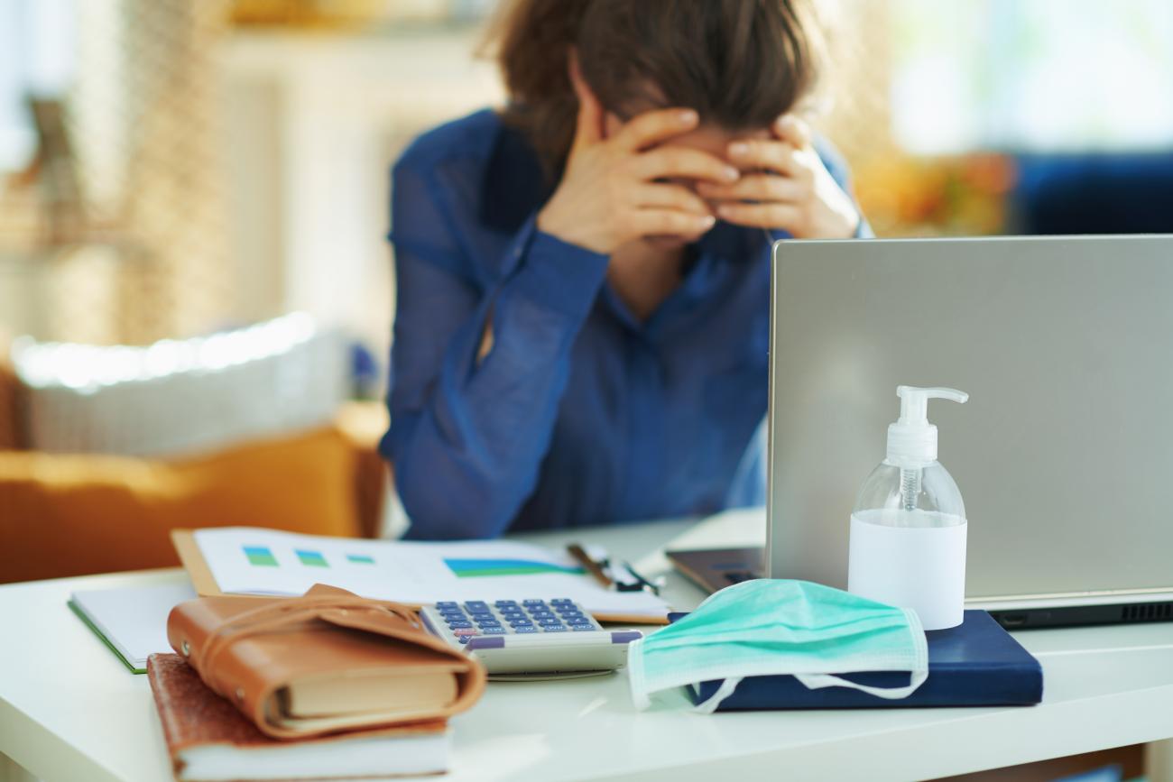 Stressed woman at computer desk