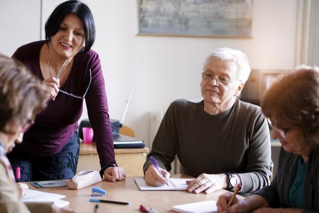 Group of people working on paperwork