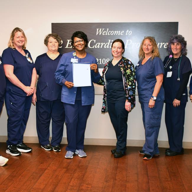 Cassandra Todd, fourth from left, poses with her team after earning a Guardian Angel pin.