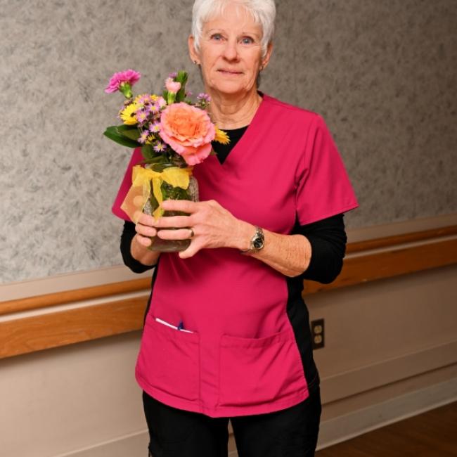 a woman holding flowers