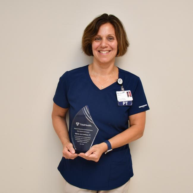 Maria Von Kollmer portrait holding Marc McDonald Award