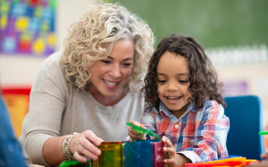 Adult and child playing with educational toy