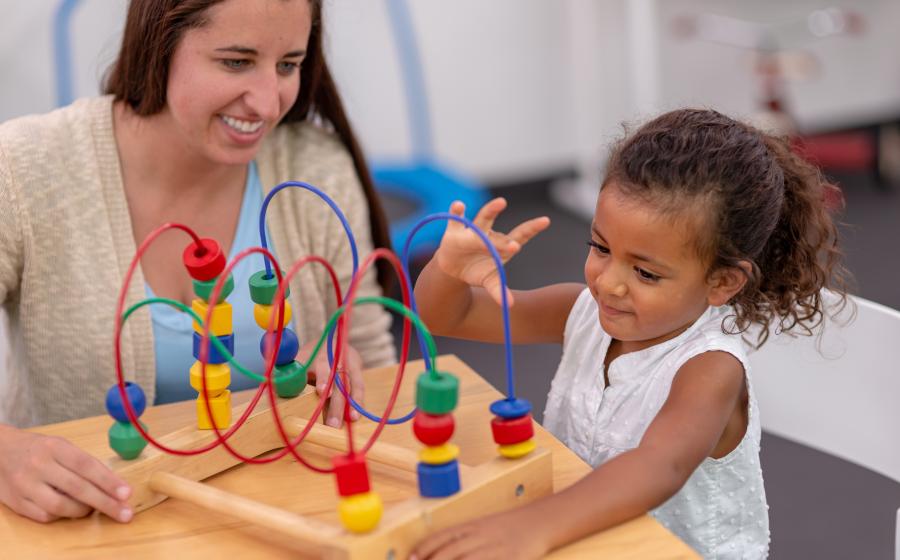 A therapist working with a young child