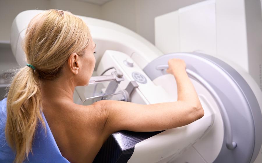 Woman receiving mammogram