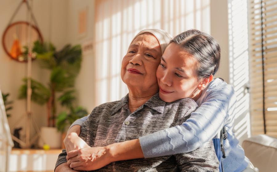woman hugging cancer patient
