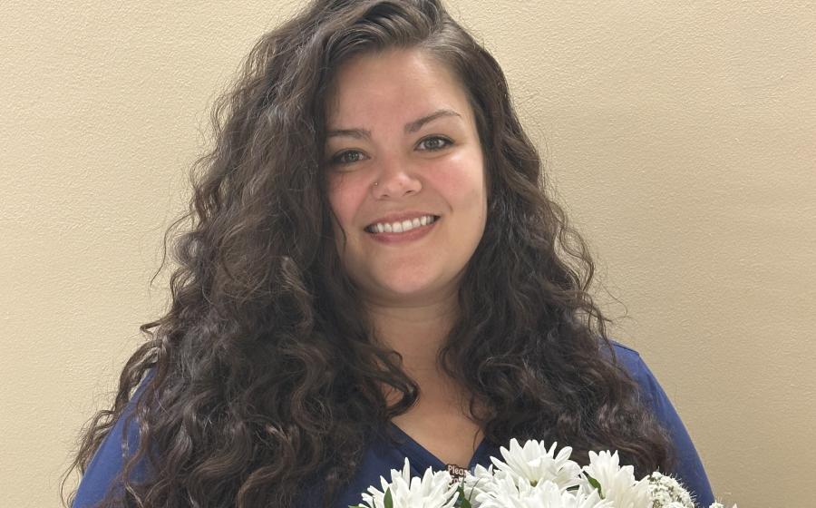 a woman holding flowers