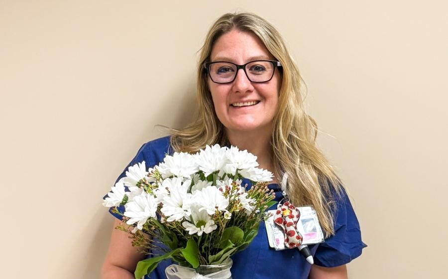 cropped photo of a woman holding daisies