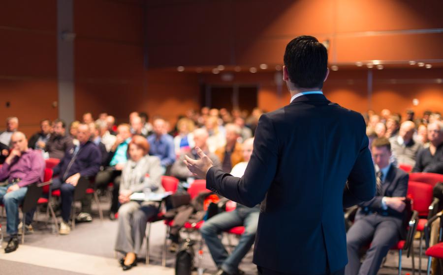 Speaker presenting in front of a group