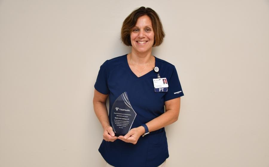 Maria Von Kollmer portrait holding Marc McDonald Award
