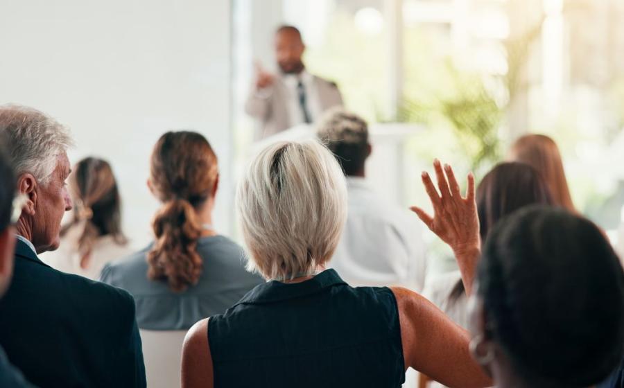 Question, raising hand at conference