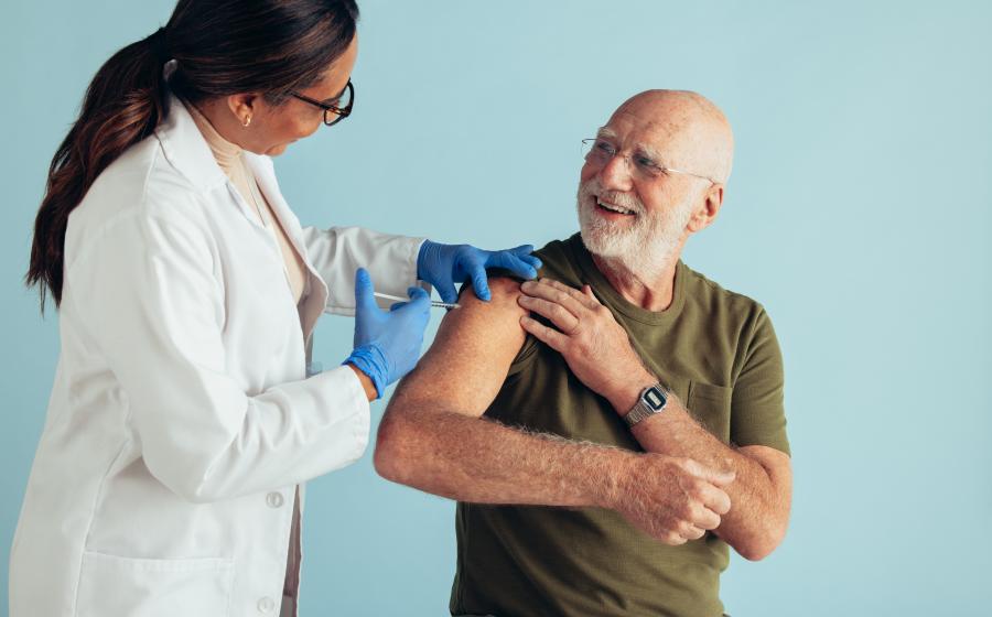 Senior man receiving immunization