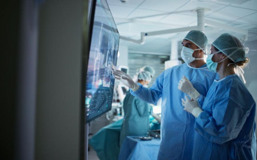two surgeons looking at x-ray